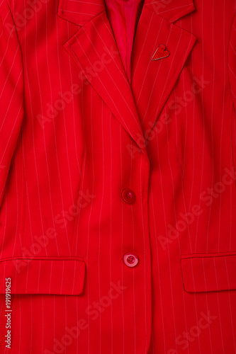 Close up female red elegant jacket. Detail of classic blazer for women.