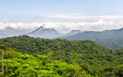 Volcan Arenal dominates the horizon above the dense jungle in central Costa Rica.