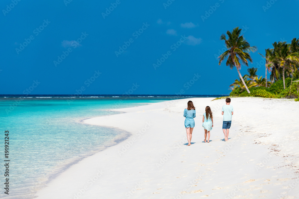 Mother and kids at tropical beach