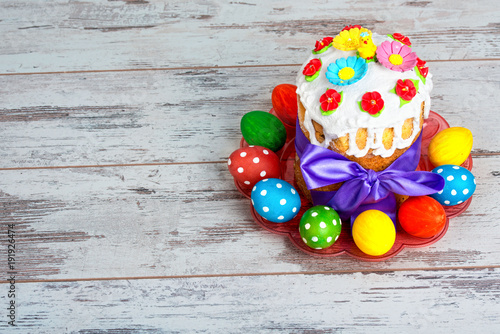 Happy Easter! Easter Cake - Russian and Ukrainian traditional kulich and colorful eggs.