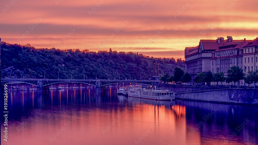 Fototapeta premium Vltava river of Prague , sunrise moment with still water from long exposure