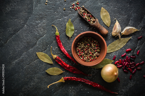 Three red chili peppers. Dry fruits. Acute burning taste.