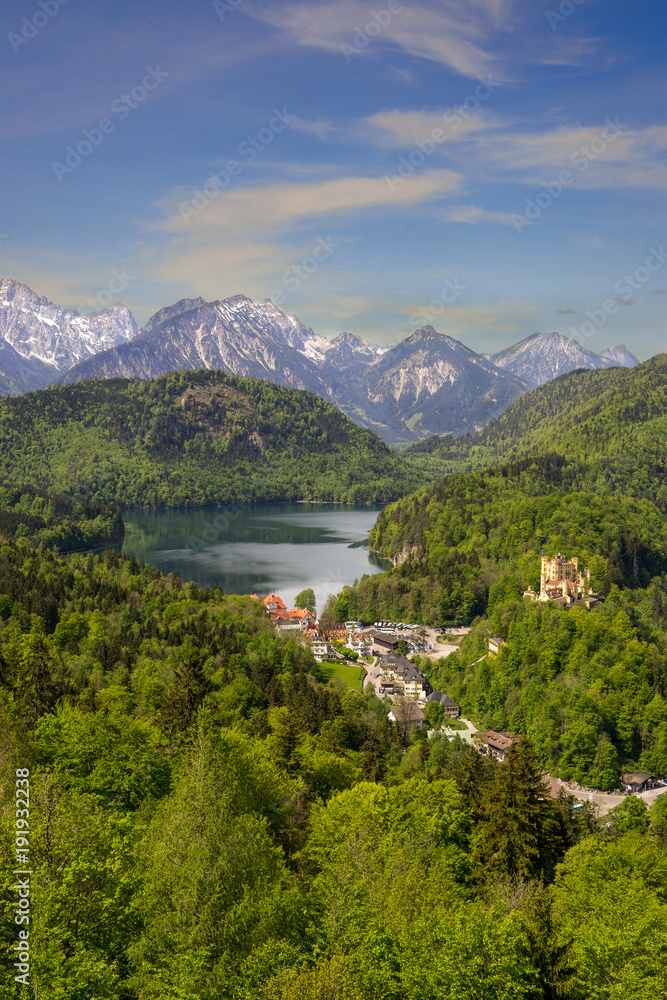 hohenschwangau Castle with Alpsee lake in summer under clear blue sky