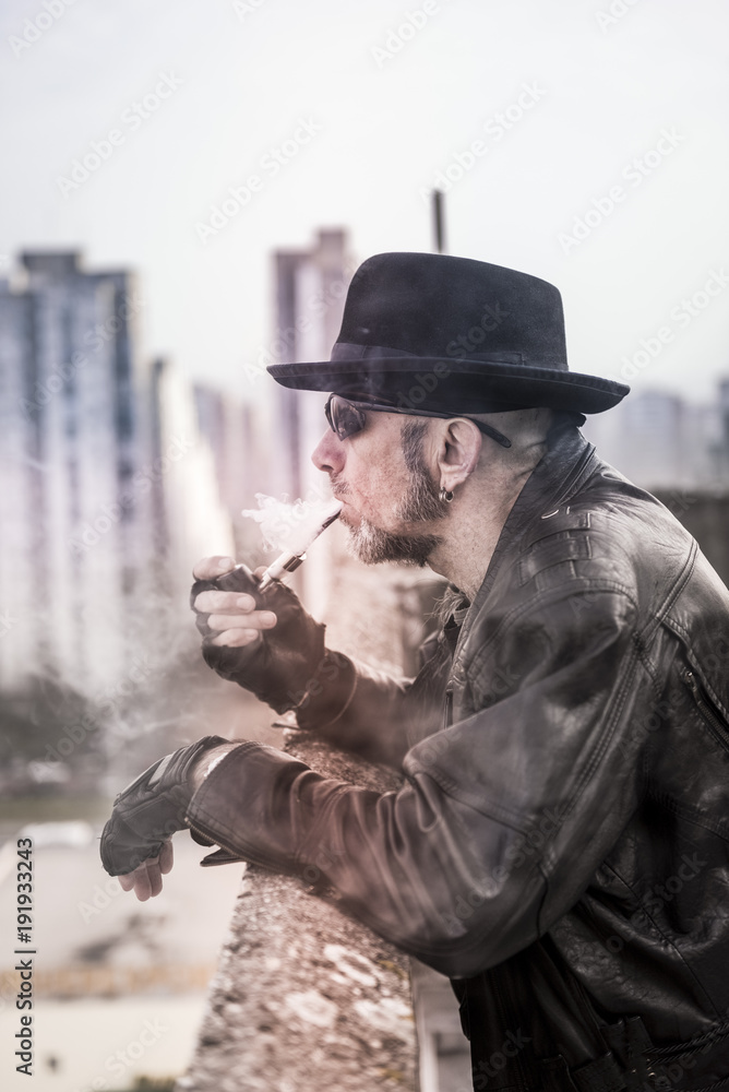 Portrait of man with smoking pipe,selective focus