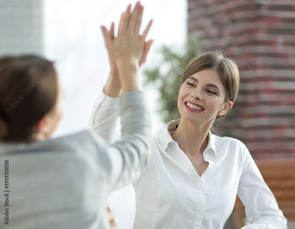 Fototapeta premium members of the business team giving each other a high five.