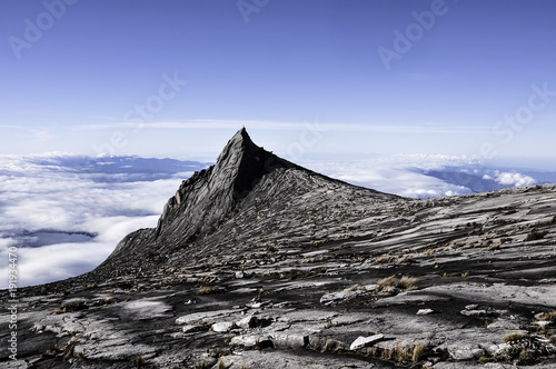 Slika na platnu Low's Peak, the highest point of Mount Kinabalu, Sabah, Malaysia with a crescent moon visible on top