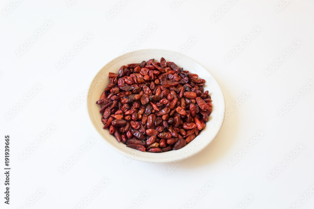 Dried red bird peppers piquin Capsicum annuum Pequin pepper, isolated on white, horizontal aspect Dried red bird peppers piquin Capsicum annuum Pequin pepper, isolated on white, horizontal aspect