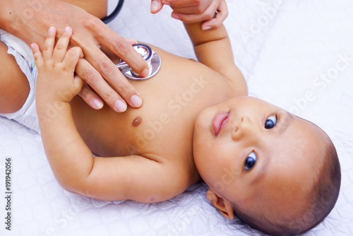 Doctor Using A Stethoscope To Listen To Baby's Chest , Baby Health Concept