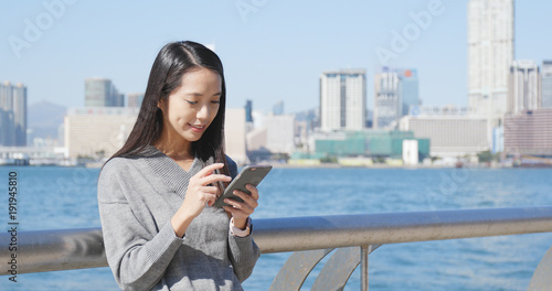 Photography Woman use of mobile phone in city