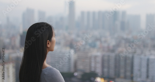 Woman looking at the city © leungchopan