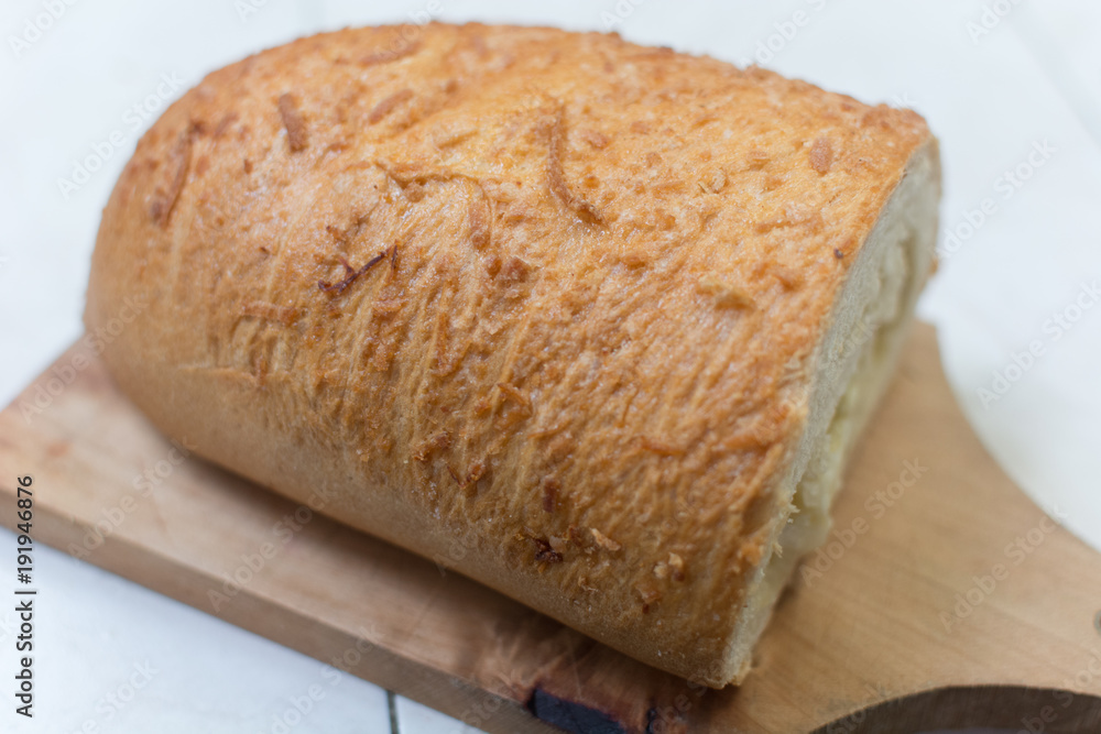 Coconut bread sliced on wood at the kitchen counter