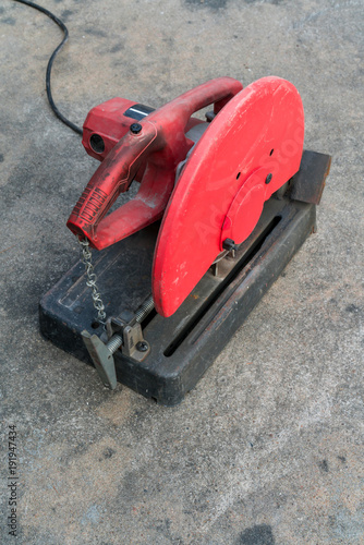 Wallpaper Mural Used Portable Fiber Cut-off Machine in red and black colors on concrete floor Torontodigital.ca