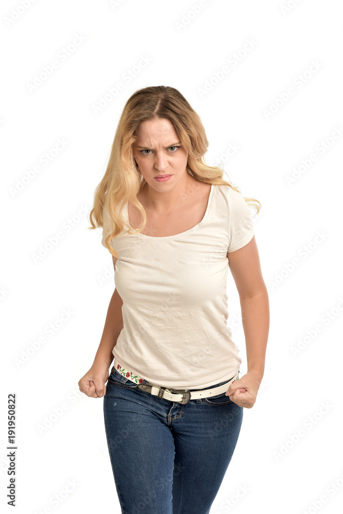 3/4 portrait of blonde lady wearing white shirt, upset expression. isolated on white studio background. 3/4 portrait of blonde lady wearing white shirt, upset expression. isolated on white studio background.