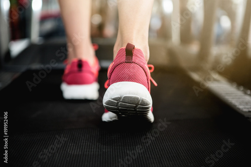 Close up image of running sport shoes jogging on the treadmill in the gym © Nitiphol