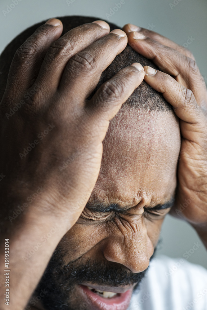 Black man suffering from migraine Black man suffering from migraine