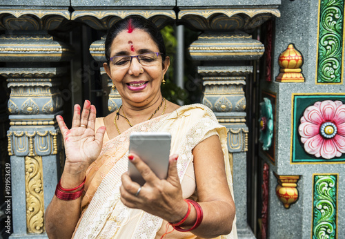 Indian people using mobile phone photo