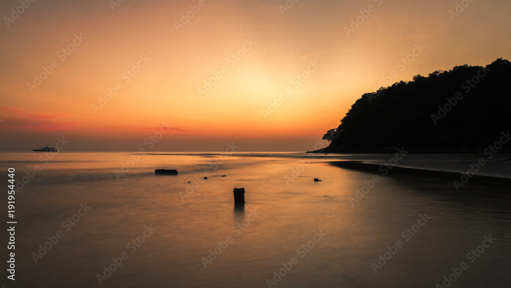 silhouette sunset at sea on beach
