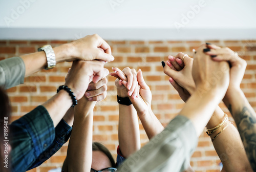 фотографія Business team raising their hands up to celebrate