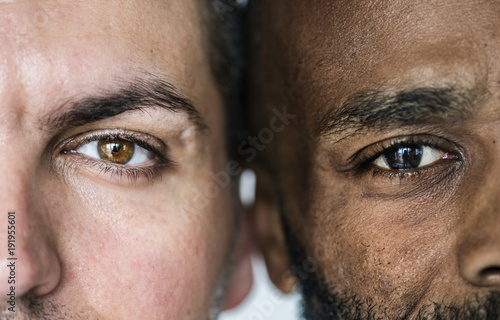Two different ethnic men&#39;s eyes closeup