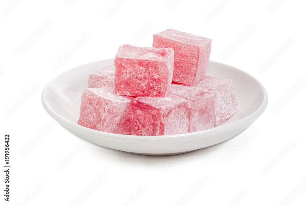 Turkish delight flavored with rose water on the white saucer Turkish delight flavored with rose water on the white saucer