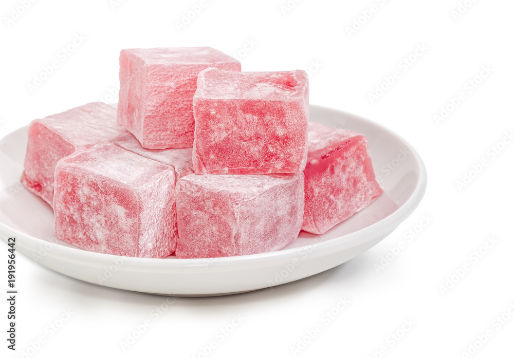 Turkish delight flavored with rose water on saucer closeup Turkish delight flavored with rose water on saucer closeup