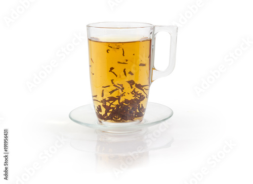 Glass cup of black tea during brewing