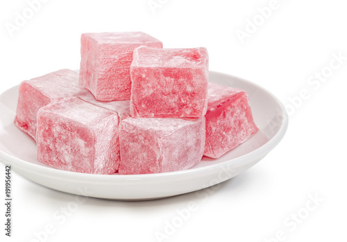 Turkish delight flavored with rose water on saucer closeup