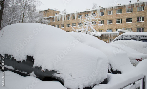 cars in the winter are in the snow