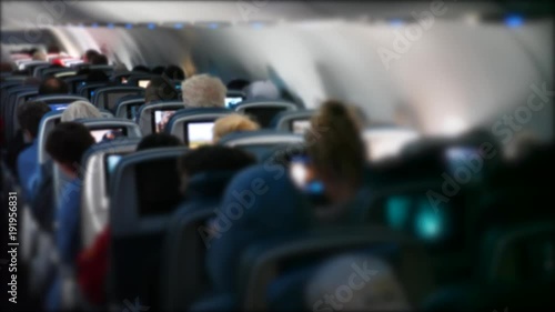 Wallpaper Mural Passengers ride on a bumpy commercial airline in their seats Torontodigital.ca