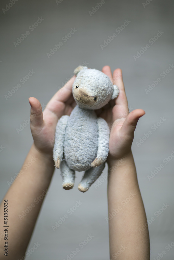 handmade bear in child hands
