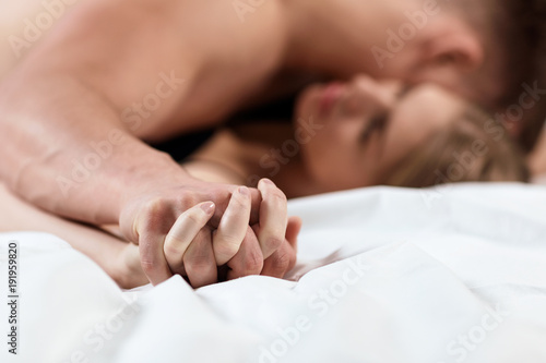 Bild auf Leinwand Focused on hands of passion couple having sex.