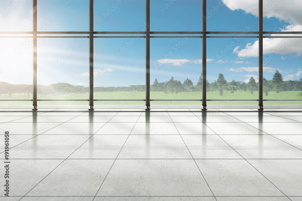 Empty room of airport terminal with trees and green field Empty room of airport terminal with trees and green field