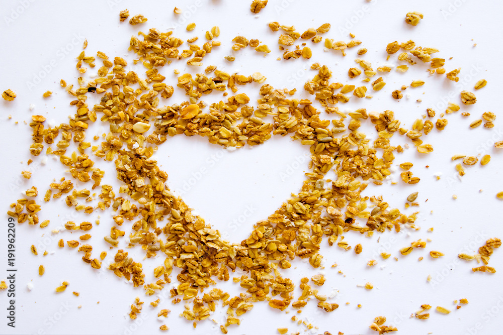 Shape Heart Granola Raisin Coconut Almond Background Top view Healthy Concept Shape Heart Granola Raisin Coconut Almond Background Top view Healthy Concept