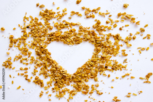 Shape Heart Granola Raisin Coconut Almond Background Top view Healthy Concept