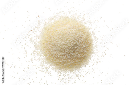 Photos raw semolina isolated on white background. Top view