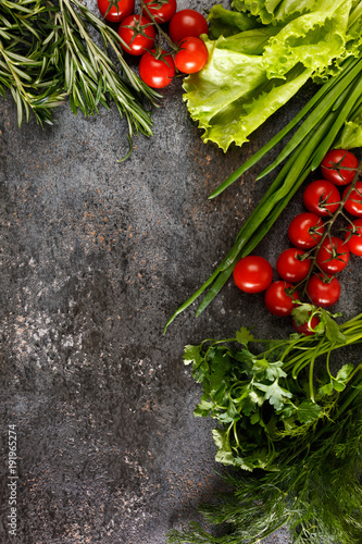 Fresh juicy vegetables with copy space on black background  top view.