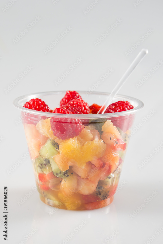 glass bowl with fresh fruits salad berries isolated on grey glass bowl with fresh fruits salad berries isolated on grey