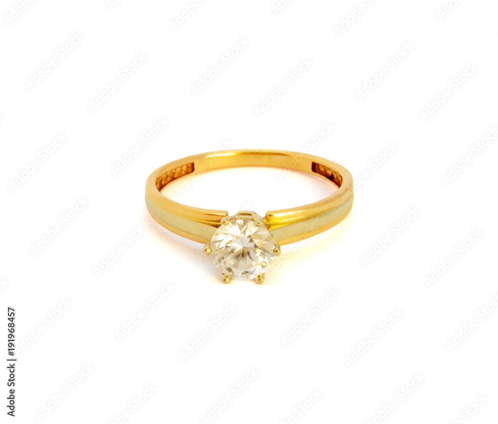 Photo of small gold jewelry decorations isolated on white background Photo of small gold jewelry decorations isolated on white background