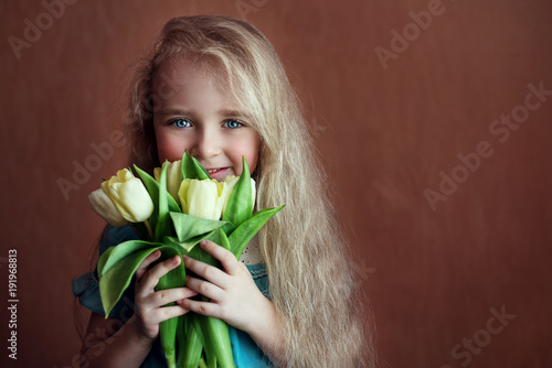 beautiful girl with tulips flowers in celebration of international women's day