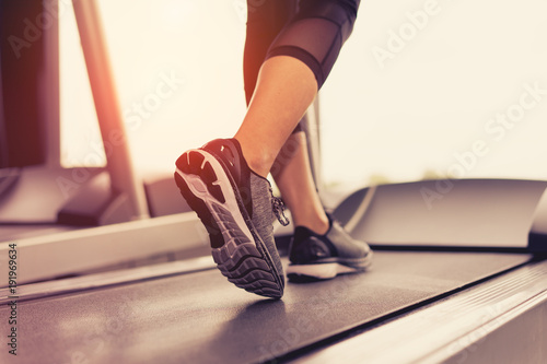 Exercise treadmill cardio running workout at fitness gym of woman taking weight loss with machine aerobic for slim and firm healthy in the morning.