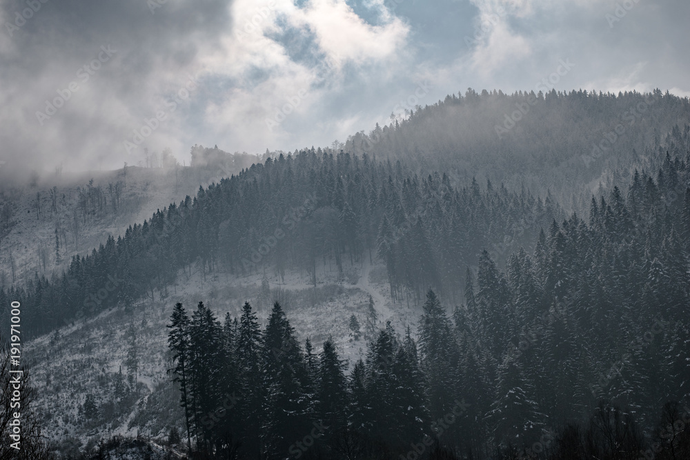 Fototapeta premium Sunset over mountain. Beautiful winter scenery.