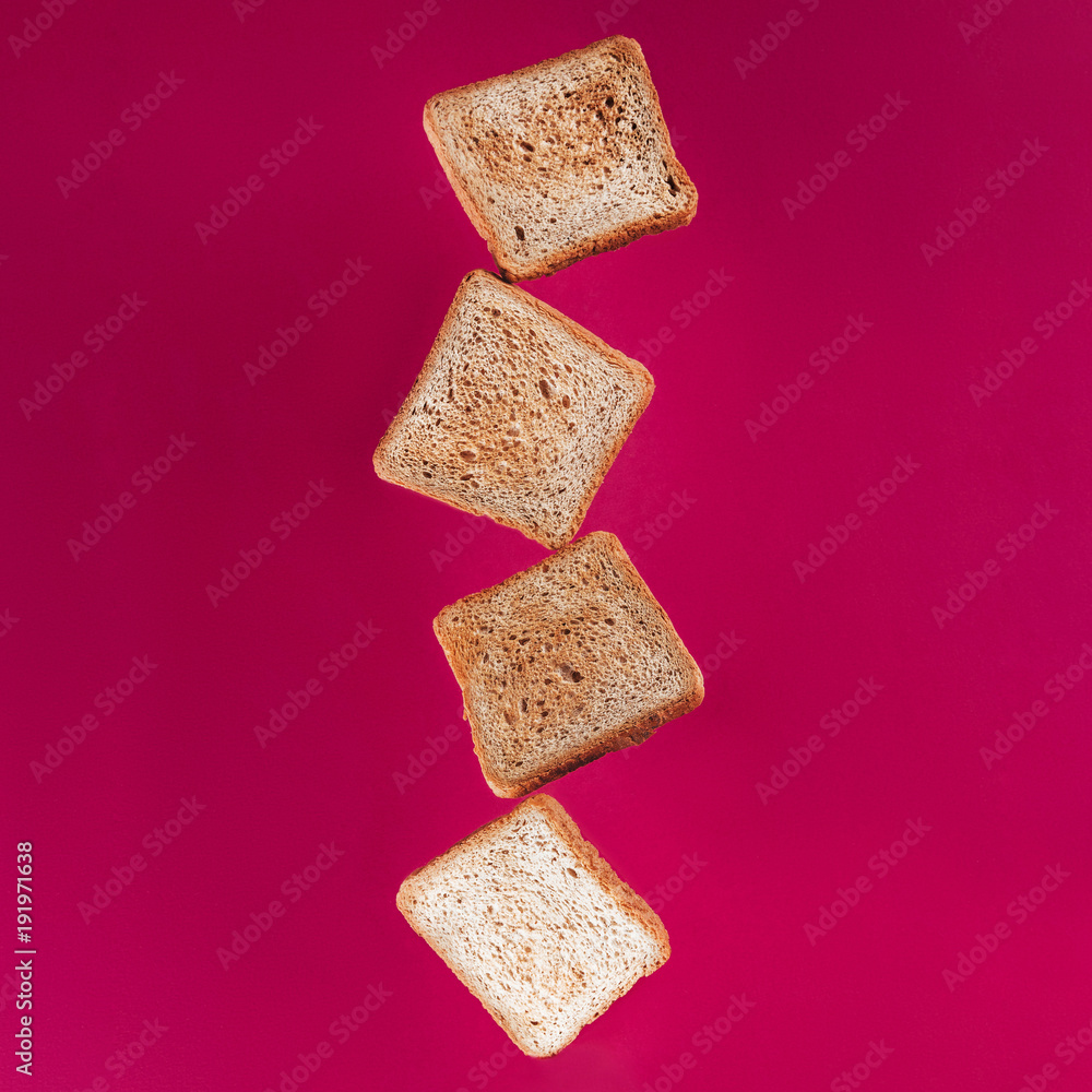 close up view of levitating toasts isolated on pink close up view of levitating toasts isolated on pink