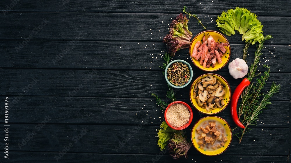 Snack supplements. Bacon, mushrooms, lard. on a wooden background. Top view. Free space for your text. Snack supplements. Bacon, mushrooms, lard. on a wooden background. Top view. Free space for your text.