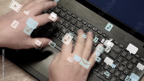 Caucasian man hands rapidly typing on laptop keyboard. Lot of speech bubbles, image icons, sound and video icons fly away. Communication in social networks, chatting. Real video with 3d animation.