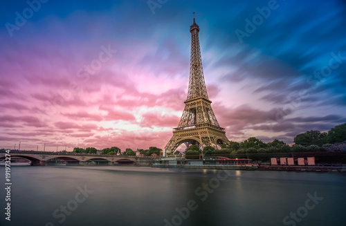 Long exposure photographyof the Eiffel Tower from Seine river in the evening time 