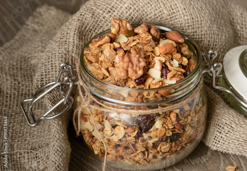 Granola from several types of cereals with nuts,coconut chips and dried cranberry. photo