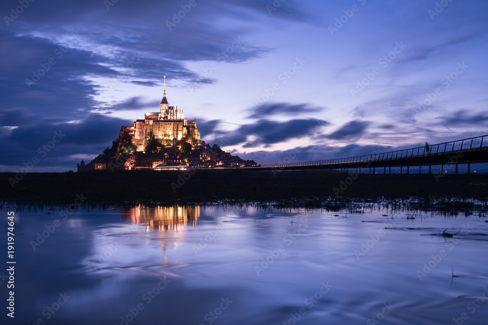 Mont Saint Michael with water reflection during night time