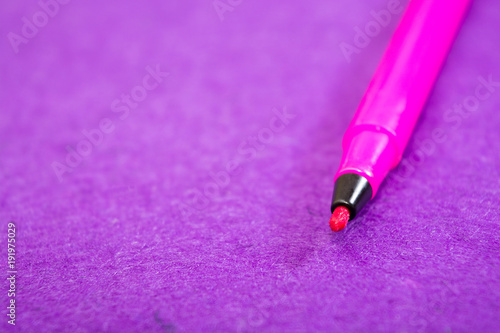 Purple felt pen on a purple felt background with space for text. Back to school. Art lessons.