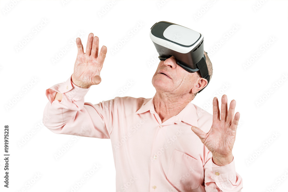 Grandfather is looking at the VR sunglasses, gestures with his hands, isolated on a white background. Grandfather is looking at the VR sunglasses, gestures with his hands, isolated on a white background.