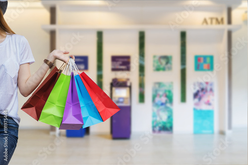 Concept of woman shopping and holding bags.